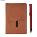Isaly Notebook and Pen Gift Set - A brown notebook with a pocket and a red pen beside it, featuring a sleek design and a branding logo.