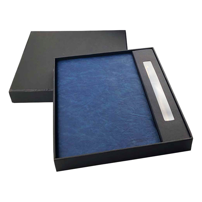 Falby Notebook and Pen Gift Set - A navy notebook and pen set presented in a black gift box, featuring a sleek design and a logo.