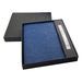 Falby Notebook and Pen Gift Set - A navy notebook and pen set presented in a black gift box, featuring a sleek design and a logo.