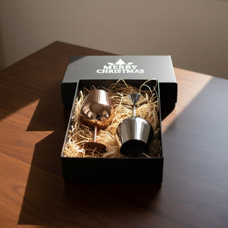 Bula Vinaka Stainless Steel Wine Glass Gift Set - A stainless steel wine glass gift set in a black box, featuring two glasses nestled in straw.