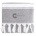 Towel & Cooler Bundle Pack - A grey towel with white fringes and a logo in the centre.