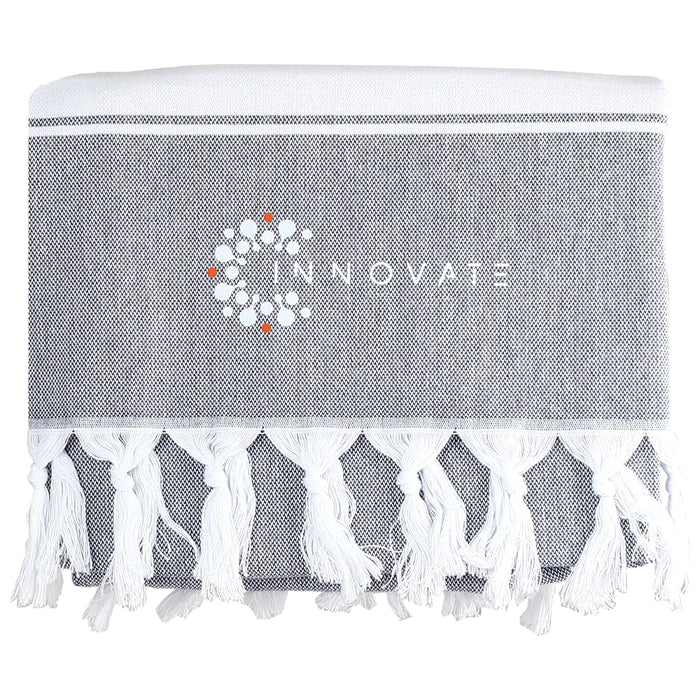 Towel & Cooler Bundle Pack - A grey towel with white fringe detailing and a logo printed on it.