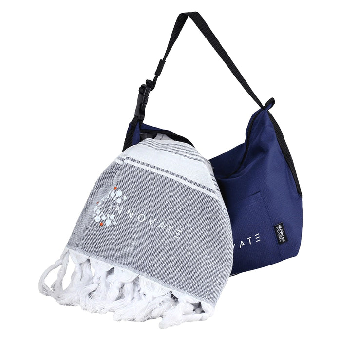 Towel & Cooler Bundle Pack - A grey and white towel with fringes is bundled with a navy blue cooler bag, featuring a logo on the towel.