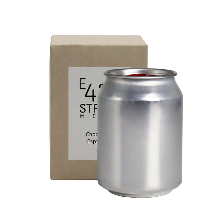 Mini East 42nd Street Can Candle - A silver can candle next to a light brown box. The candle has a minimalist design and is labelled as "Choc Espresso".