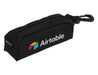 Links Golf Pack - A black pouch with a zip closure and a clip, featuring a logo on the side.