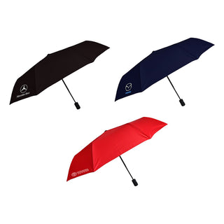 Poppins Umbrella - Three umbrellas in black, navy, and red, each featuring a logo on the canopy.