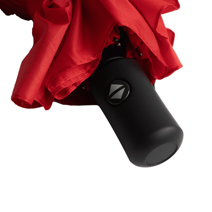 Poppins Umbrella - A red umbrella with a black handle and a logo, neatly folded.