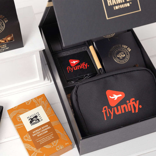 Branded Tech Kit Gift Pack - A black gift box contains a branded tech kit, featuring a black pouch, notebook, pen, and snacks.