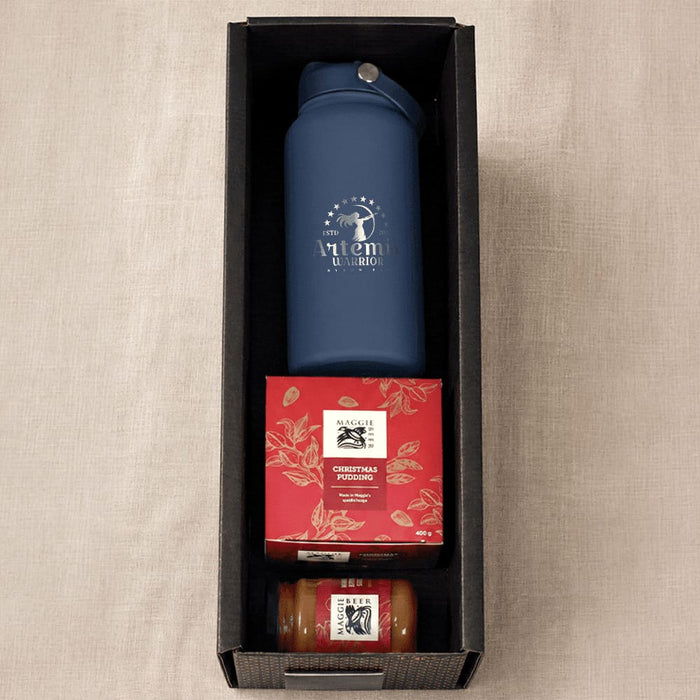 Festive Essentials Set - A blue drink bottle, a Christmas pudding, and a jar of sauce in a black box hamper.