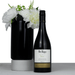 The Entertainer Set - A black wine bottle of Mr. Riggs McLaren Vale Shiraz, accompanied by a black vase with white flowers.