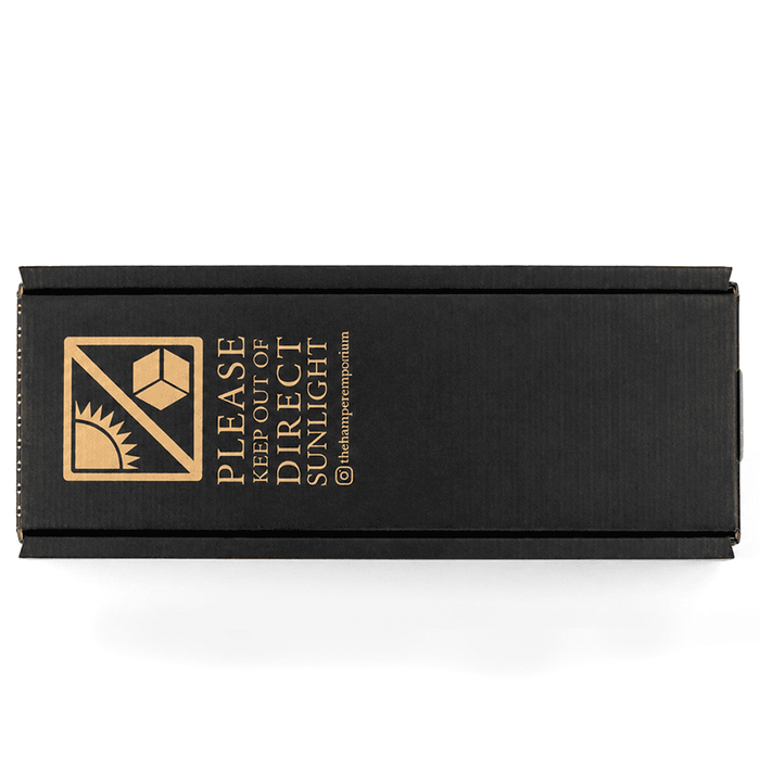 The Entertainer Set - A black box with a logo and instructions for care, featuring a gold design on the lid.