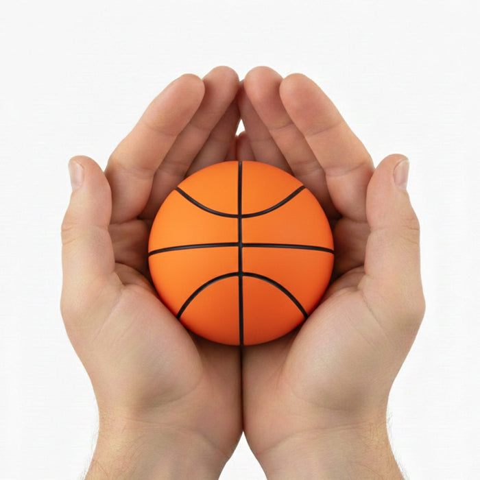 High Bounce Basket Ball - An orange basketball held in two hands, featuring black lines for seam details. The hands cradle the ball gently.