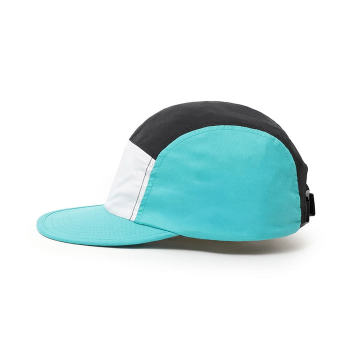 6-Panel Soft Peak Cap - A 6-panel cap featuring black, white, and aqua panels with an adjustable strap and a logo.