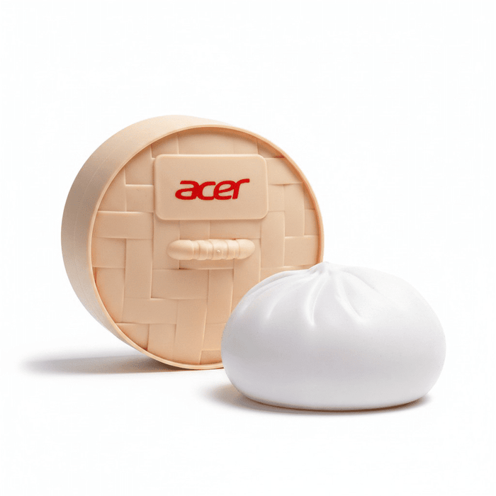Squishy Bun - A squishy bun-shaped stress toy in white with a beige woven basket container, featuring a logo on the front.