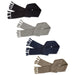 Ruga Knit Scarf - A Ruga Knit Scarf in four colours: black, grey, navy, and olive, featuring fringed edges and a textured design.