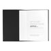 Mela Apple Leather Refillable Journal - A Mela Apple Leather Refillable Journal with a black cover, featuring a white interior for notes and a branding logo.