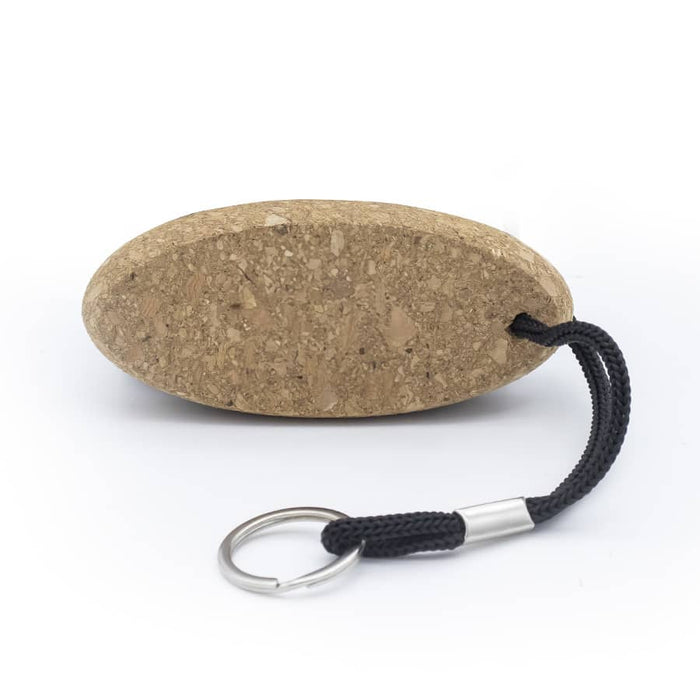 Cork Floating Keychain - A cork keychain with an oval shape and a black strap for attaching. It features a metal keyring.