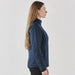 Women's Pacifica Thermal Jacket - A side view of a women's navy thermal jacket, featuring a collar and zippered design. The model has long hair.