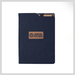 SunScribe Notebook (A4) - A navy notebook with a textured cover and a brand logo in the centre. Features an exterior pocket.