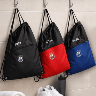 The Buddy Drawstring Bag - Three drawstring bags hang on hooks; one black, one red, and one blue, each featuring a logo and zip pocket.