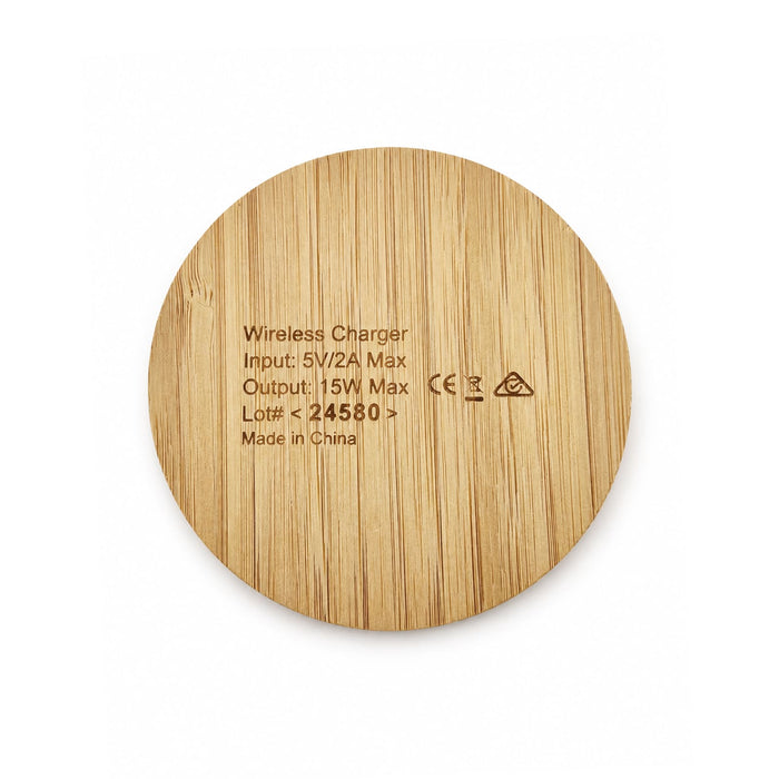 Crescent Illuminating Wireless Charger - A round wireless charger made of bamboo, featuring a smooth, natural wood finish and a logo.