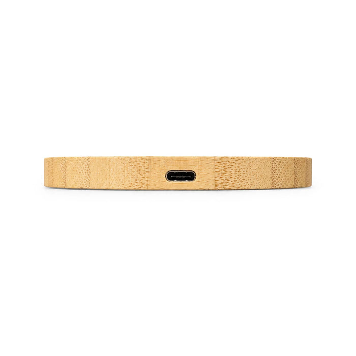 Crescent Illuminating Wireless Charger - A wireless charger in a natural wood finish, featuring a USB-C port at the back.
