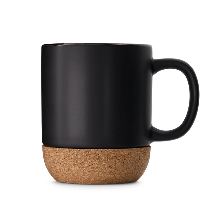 The Warm Welcome - A ceramic mug with a matte black finish and a cork base. It features a single handle and branding.