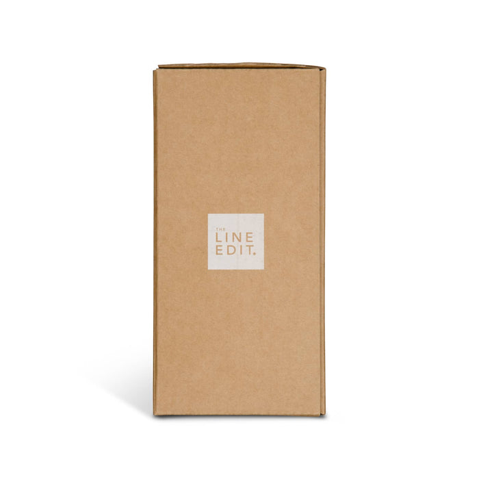 Esplanade Coffee Cup by The Line Edit. - A rectangular cardboard box with a logo on the front, featuring a neutral brown colour and a simple design.