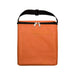 The Knock Off for Christmas Pack - An orange cooler bag with a black strap and a front pocket, featuring a zipper closure.