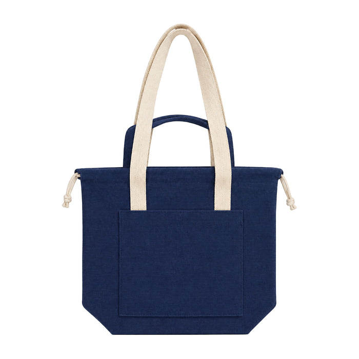 Darby Tote Bag - A navy tote bag with cream handles and a front pocket, featuring a branded logo.