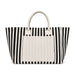 The Play & Graze - A striped tote bag in black and white with a plain cream-coloured front pocket and handles. It has a logo.
