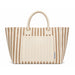 The Weekend Edit - A striped tote bag in beige and cream featuring two handles and a front pocket. Branding is present on the bag.