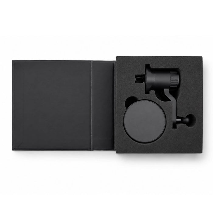 Anchor by Nomis Car Phone Holder - A black car phone holder with a mount, displayed inside a black packaging box. The product includes a holder and a base.