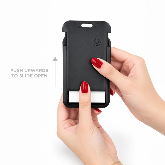 Jet Luggage Tag Tracker - A black luggage tag tracker is being held, featuring a sliding mechanism and a logo on the front.