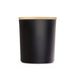 The Brew Ritual - A large black glass candle with a smooth finish and a bamboo lid. Minimalistic design with a sleek appearance.