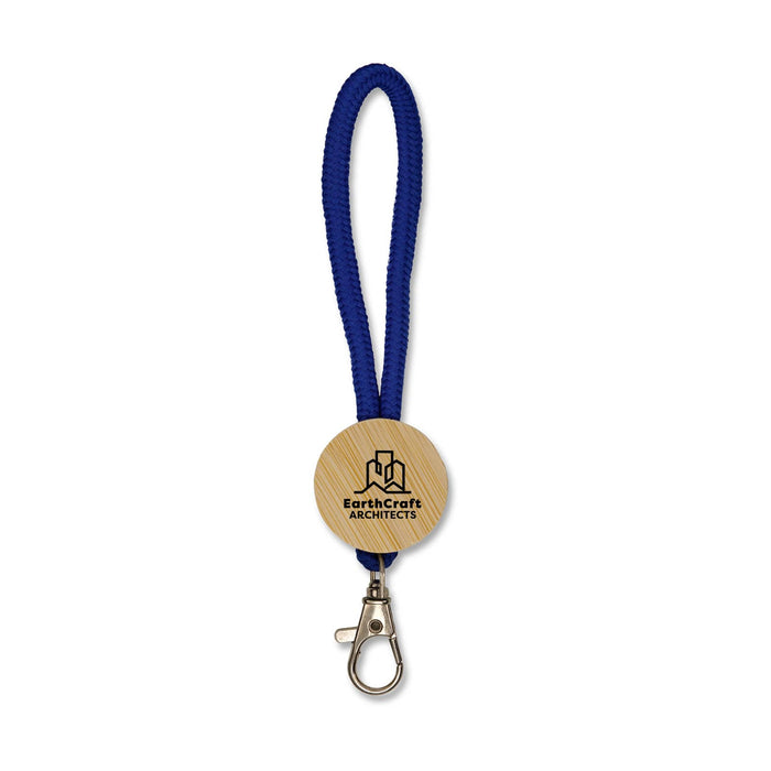 Luxeloop Keytag - A blue keytag with a wooden circular attachment featuring a logo and a metal clip.