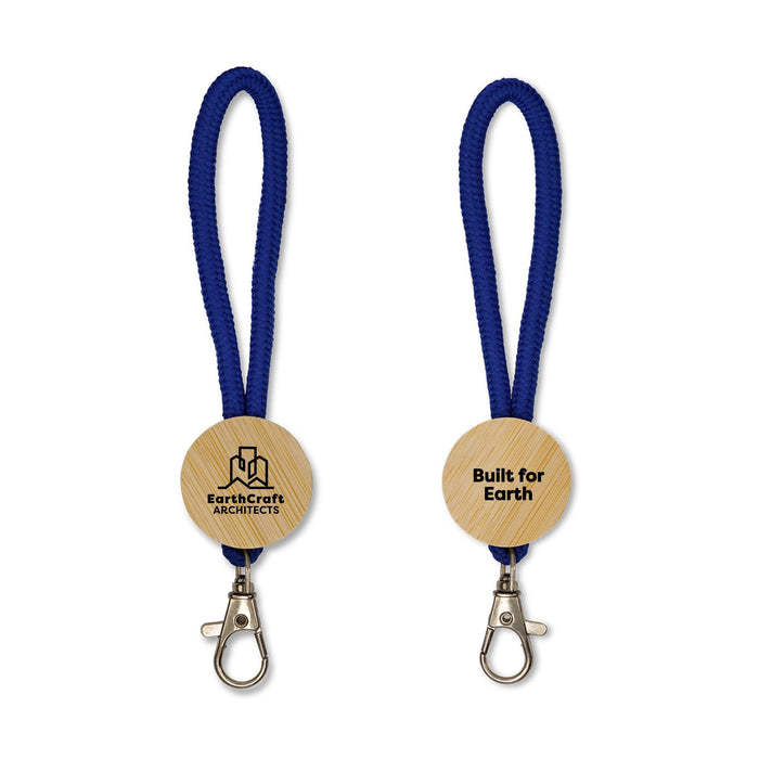 Luxeloop Keytag - A wooden keytag with a blue fabric strap and a metal clip, featuring a branding logo on one side.