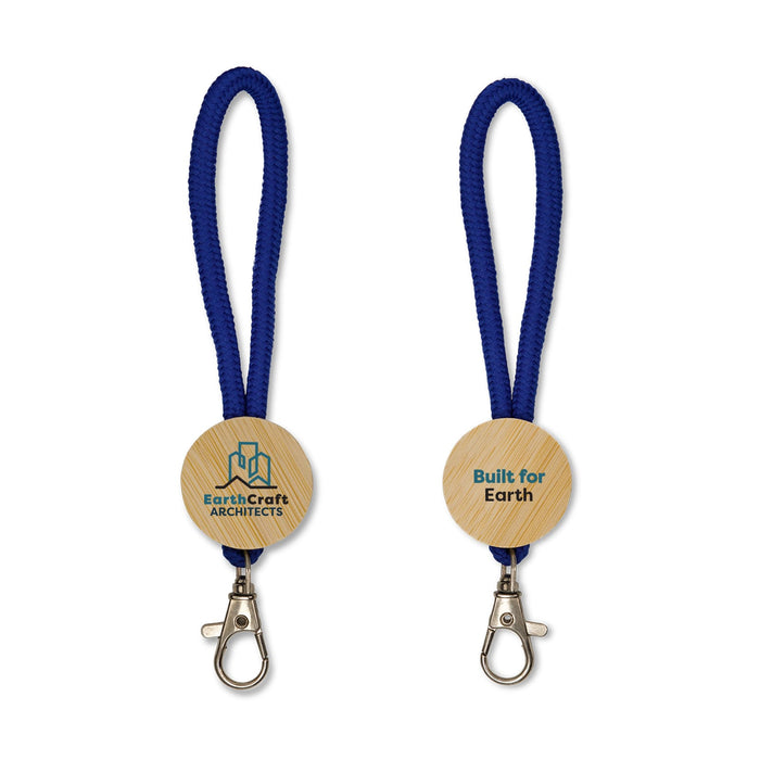 Luxeloop Keytag - A keytag with a wooden circular base, featuring a logo and attached to a blue braided lanyard.