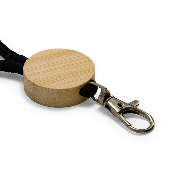 Luxeloop Keytag - A round bamboo keytag with a black cord and a metal clip attachment.
