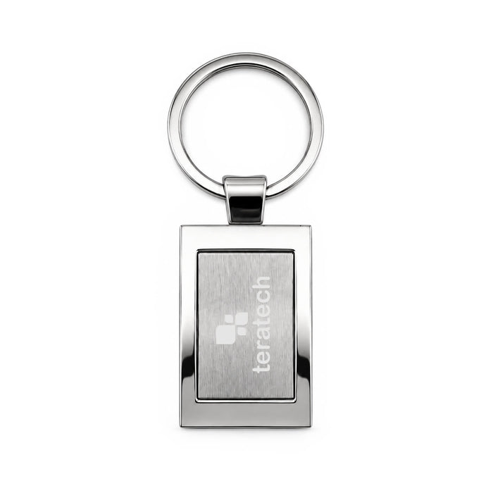 Frame Keytag - A silver keytag with a rectangular frame and a circular keyring, featuring a branded logo.