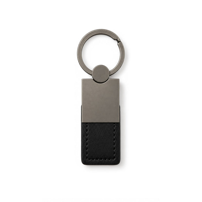 Mario Keytag - A sleek, black leather keytag with a metallic silver keyring attachment and minimalist design.