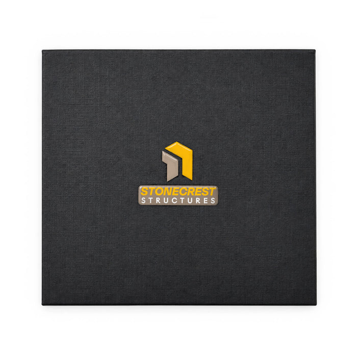 Trail Multi Tool - A black textured folder featuring a logo in the centre. The logo includes yellow and grey elements.
