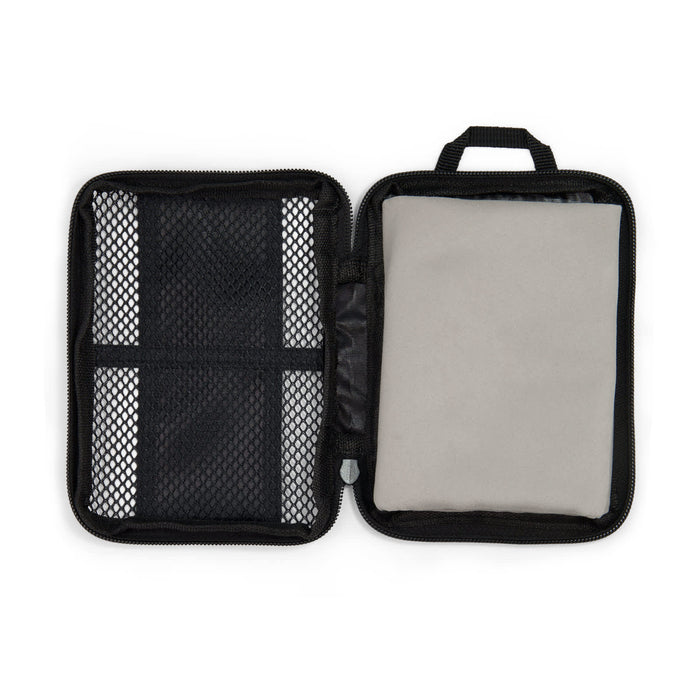 The Hustle Pack - A zipped storage case featuring a mesh pocket and a padded compartment, primarily in black with a light grey interior.