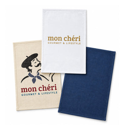 Haven Large Cotton Tea Towel - Three cotton tea towels in beige, white, and navy, featuring a logo and various designs.