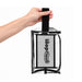 Laynie Clear Cosmetic Bag - A clear cosmetic bag with a black handle and a branded logo, held by a hand.