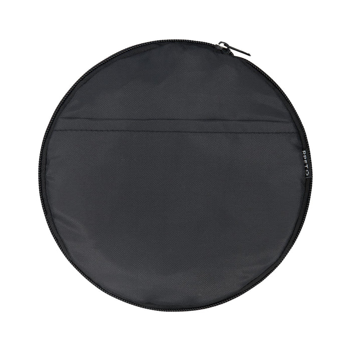 The Hustle Pack - A round black duffle bag with a zip closure and a flat pocket on one side. It features a logo.