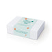 The Warm Welcome - A white gift box featuring a light blue label with holiday-themed illustrations and a festive message.