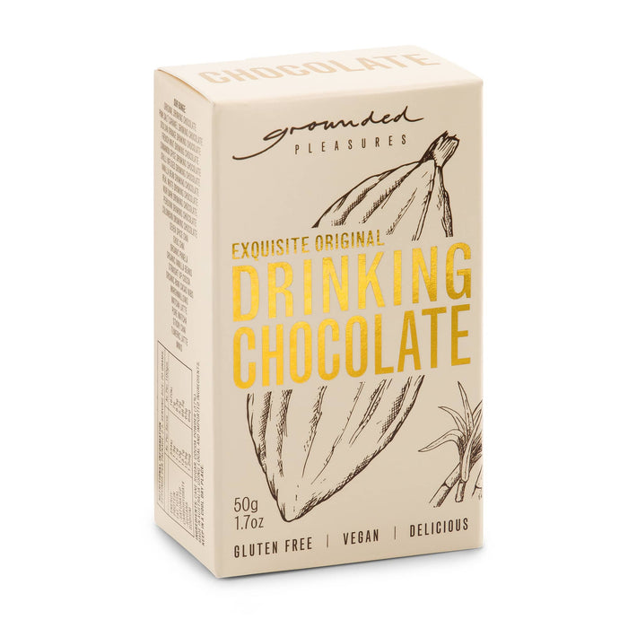 The Winter Warmer Pack - A package of drinking chocolate in cream and beige, featuring a logo and a sketch of cocoa pods.