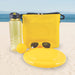 Bondi Beach Pack - A drink bottle, a frisbee, a yellow ball, and a pair of sunglasses are arranged alongside a bright yellow cooler bag.