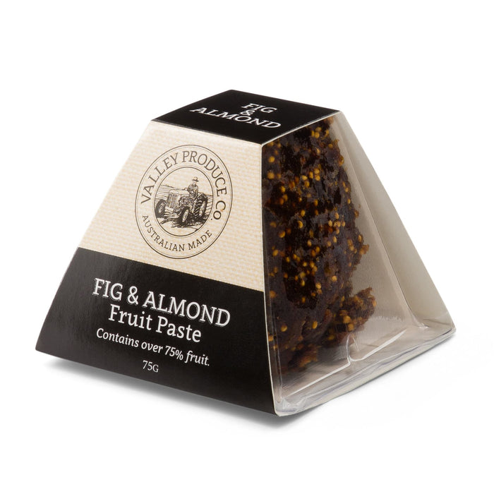 The Big Indulge - A triangular package of fig and almond fruit paste, featuring a dark brown and cream design, with a logo.